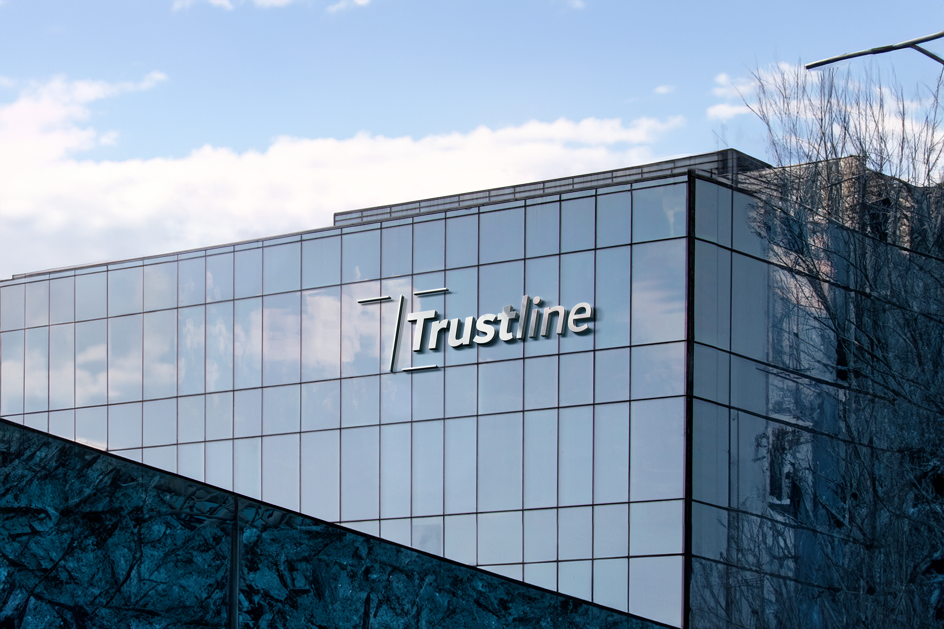 Exterior view of a building with the Trustline logo prominently displayed on a glass facade.