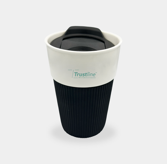 Trustline Enterprises branded reusable coffee cup with a black textured sleeve and a white lid.