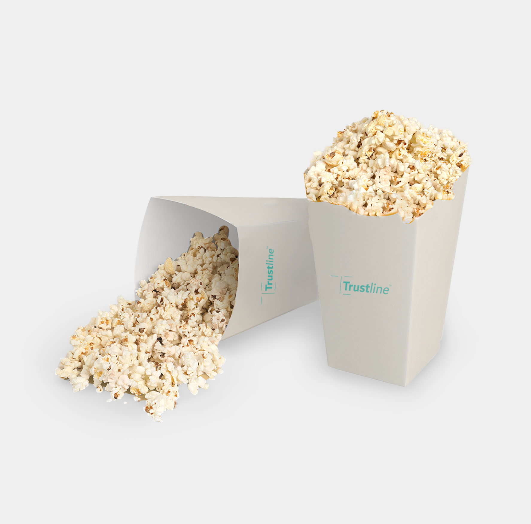 Trustline Enterprises branded popcorn containers, one upright and one tipped over with popcorn spilling out.