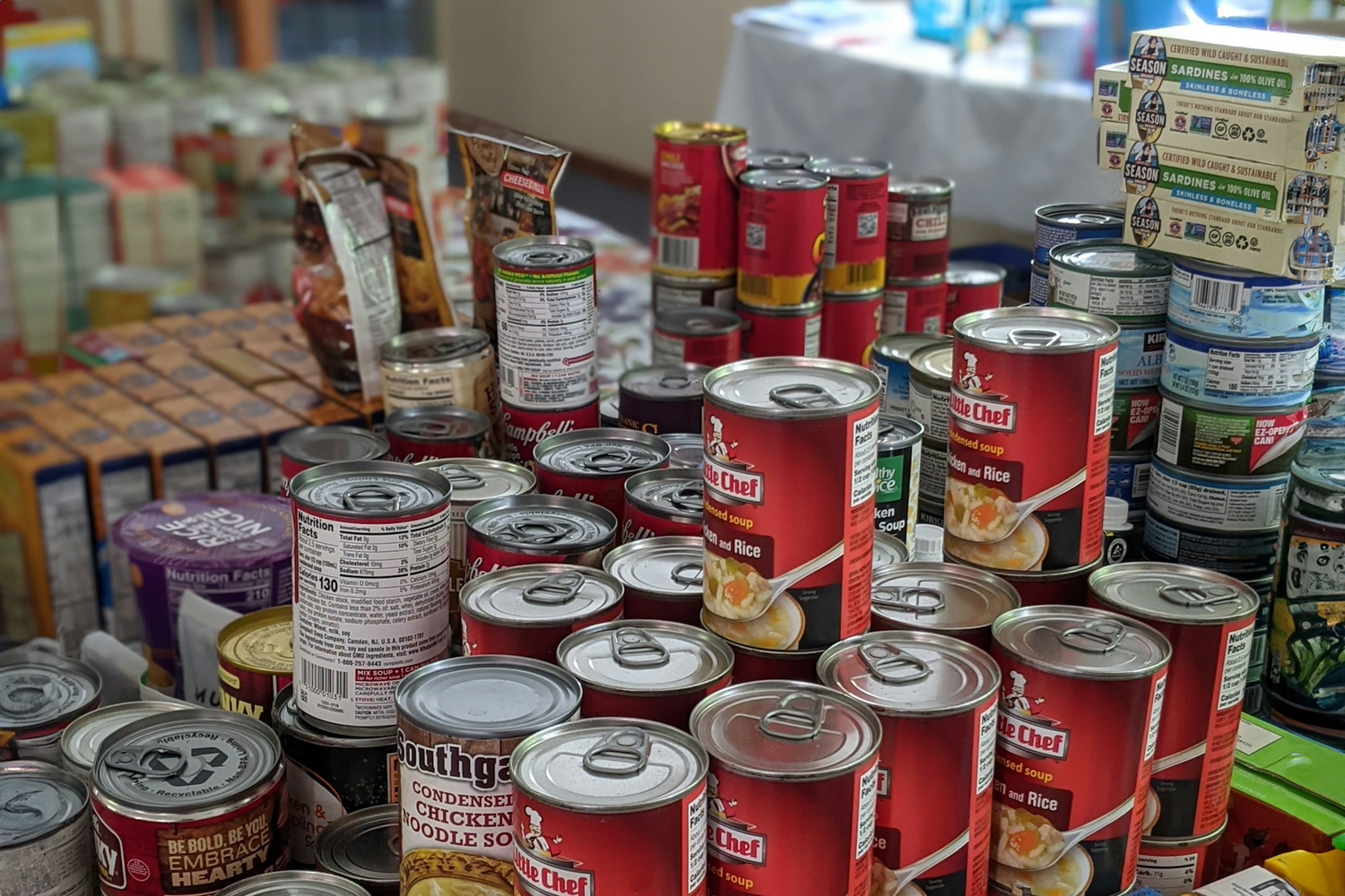 Assorted canned food products neatly arranged, showcasing Trustline Enterprises' efficient FMCG distribution services for retail and foodservice industries.